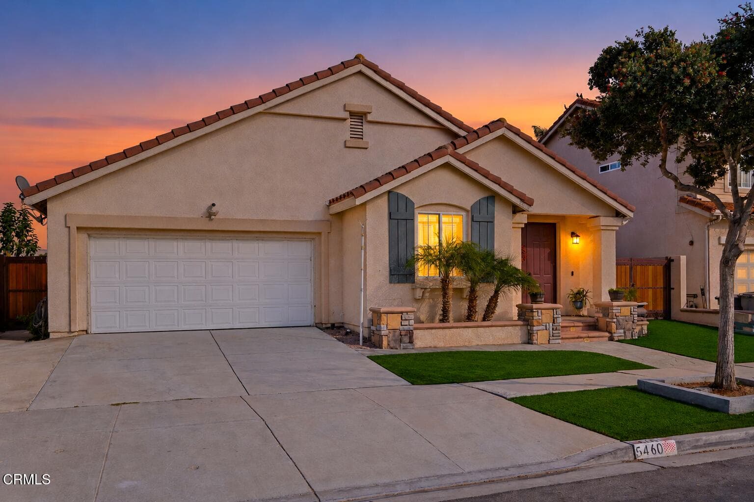 Twilight Suburban Home with Warm Glow
