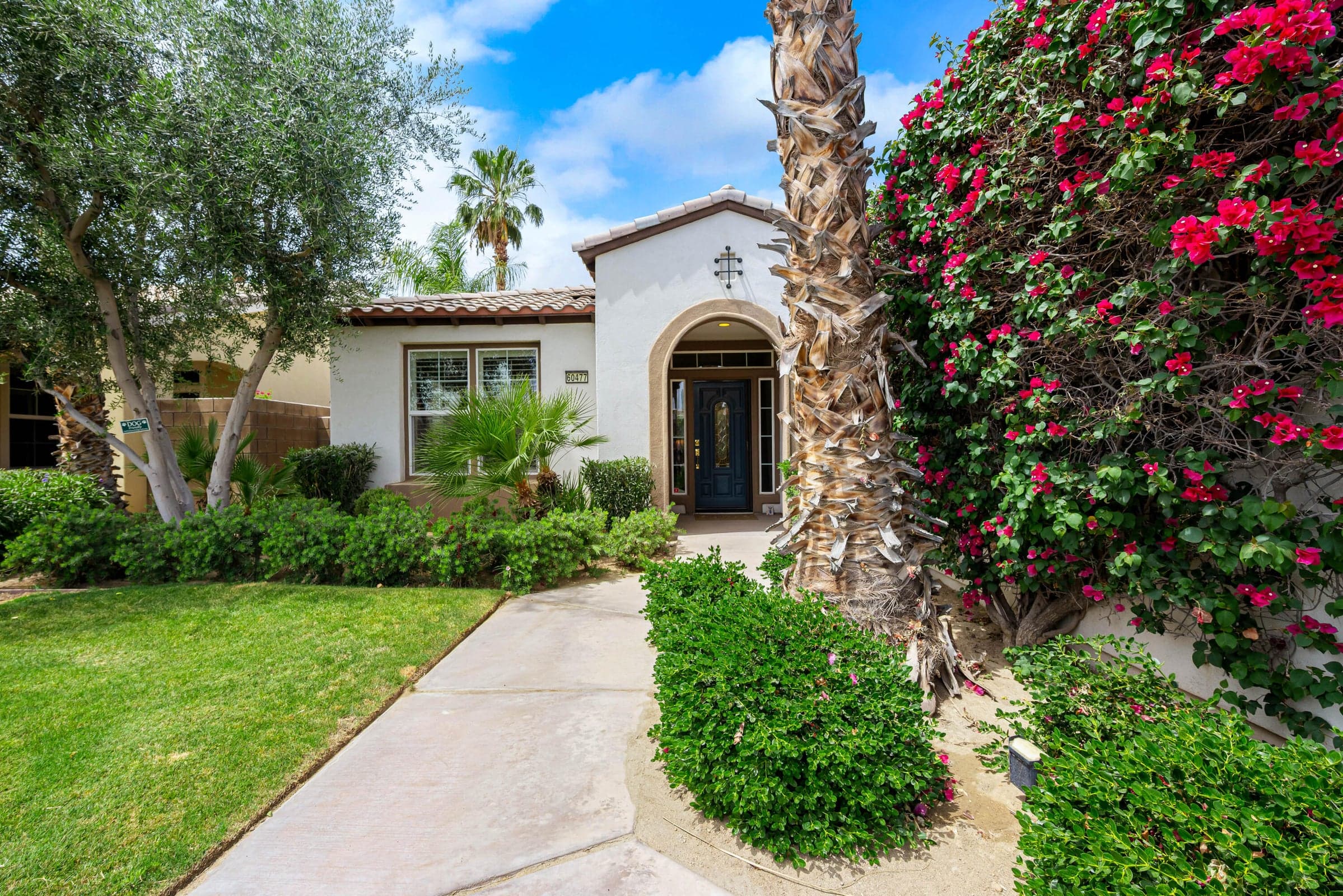 Popular Spanish style home with arched entry.