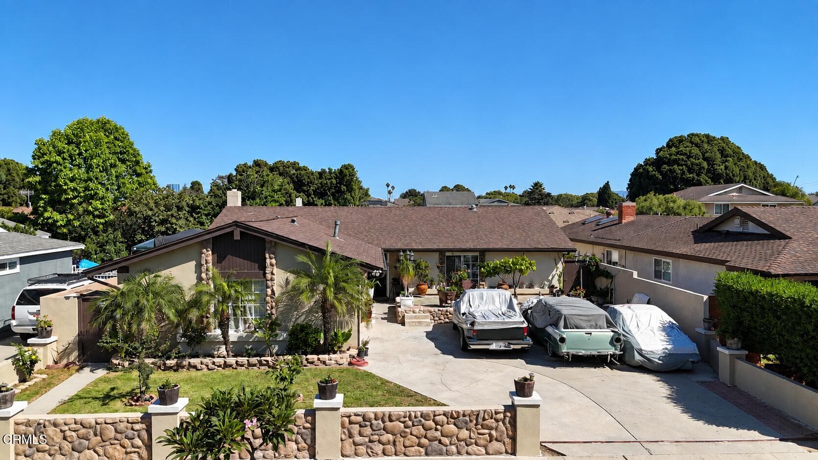 Sunlit Ranch House with Classic Cars