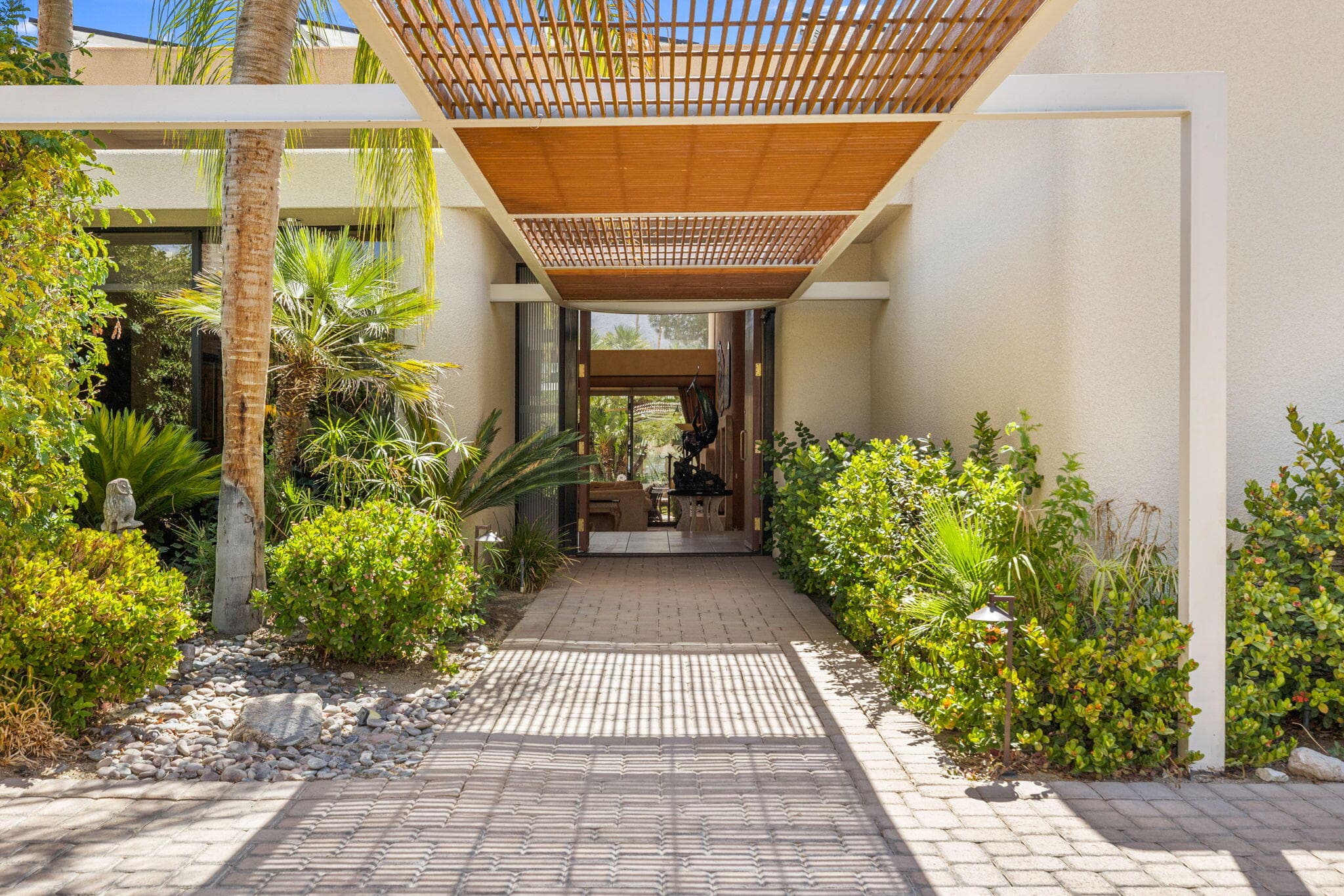 Follow the impressive pathway to the stately front entrance of this iconic David Prest design, where exceptional architecture and refined elegance unfold at every turn.