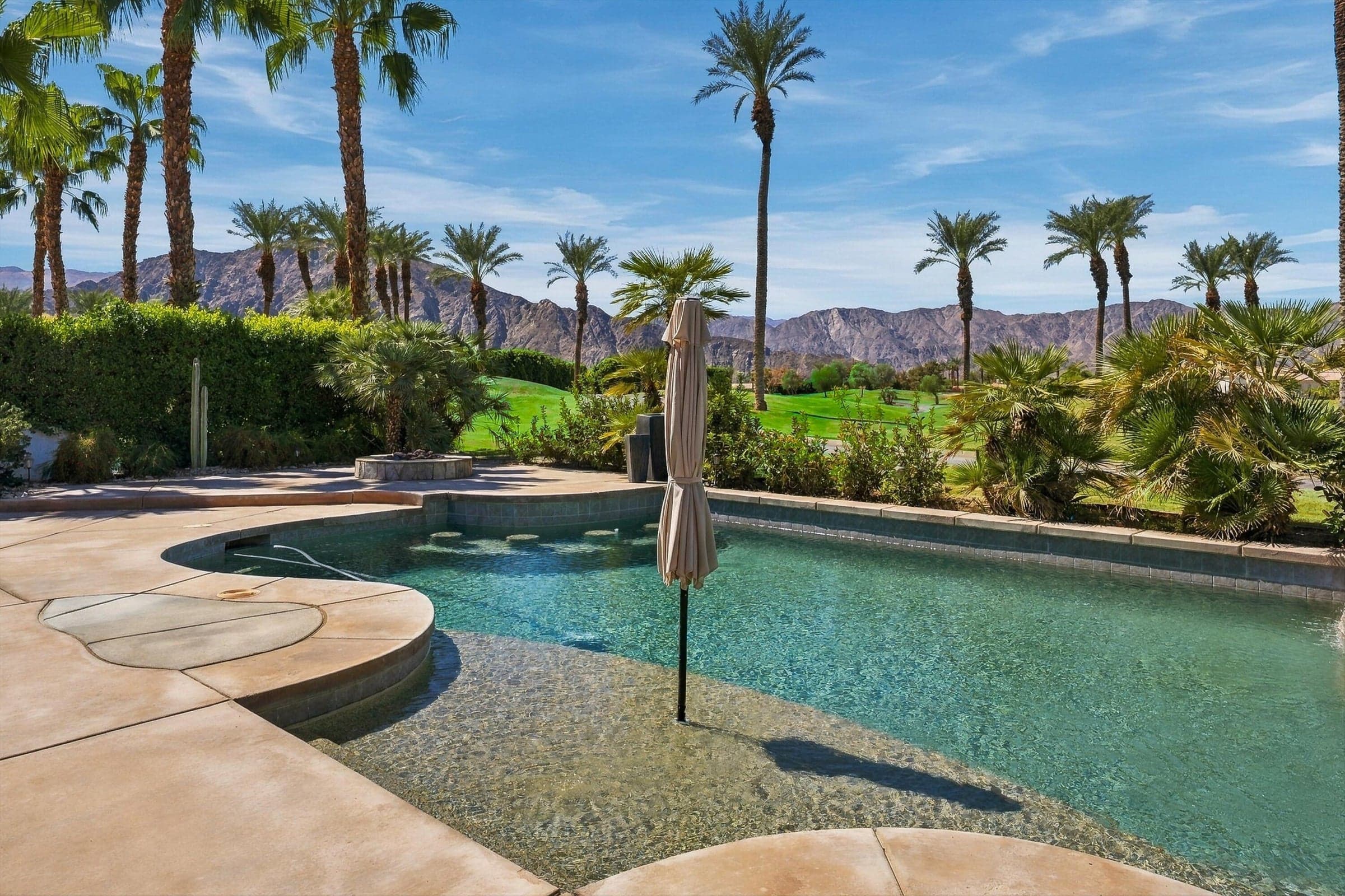 Large pool with mountain views
